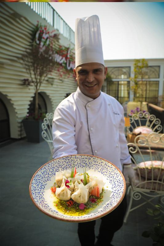 The chef presenting a plated dish
