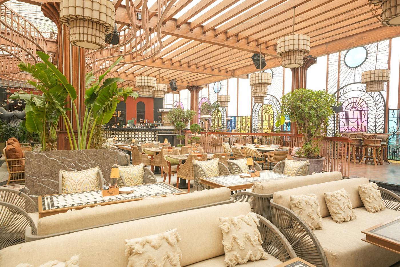 The terrace at Romeo Lane with lounge seating under a timber canopy